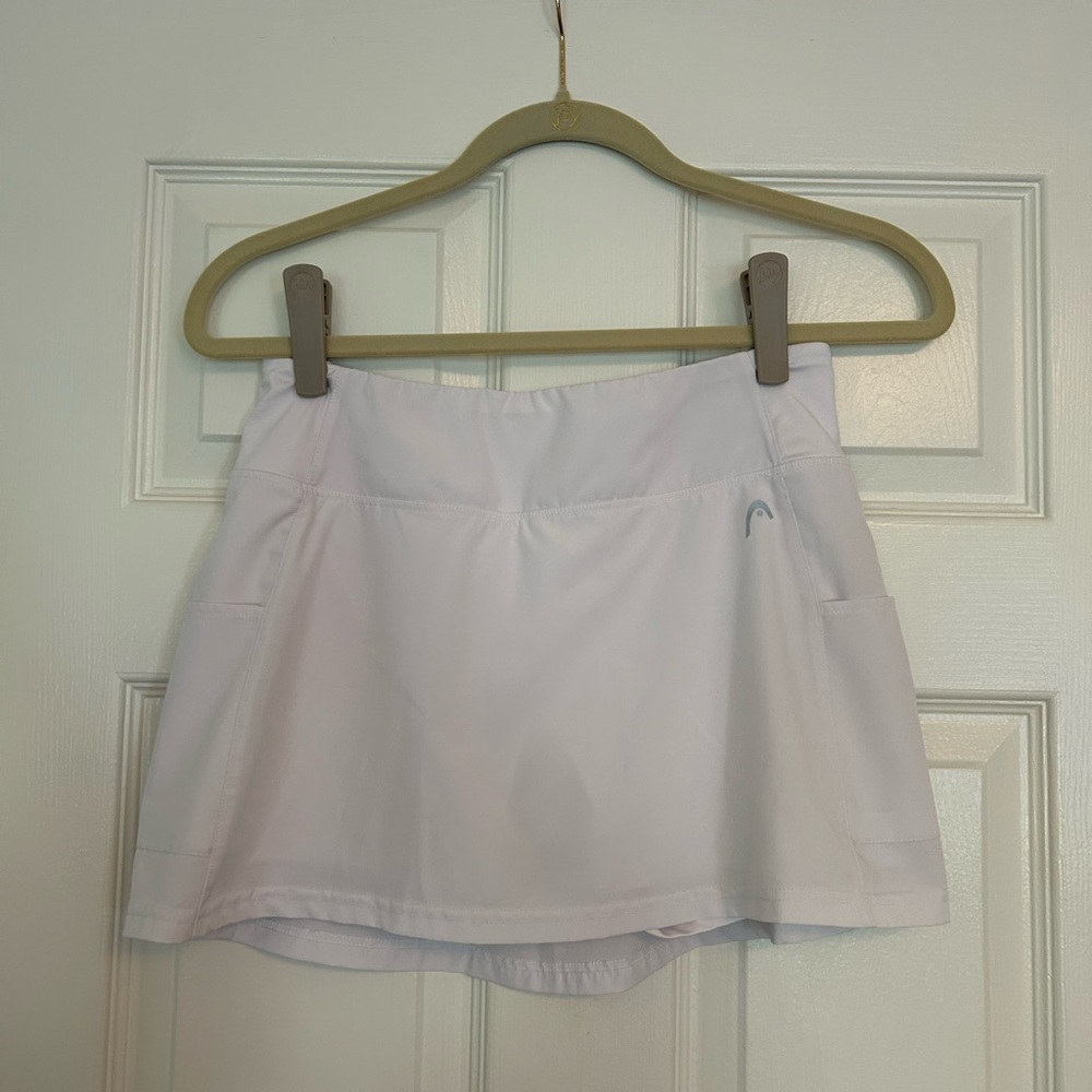 White Head tennis skirt with suit in shorts size Small.